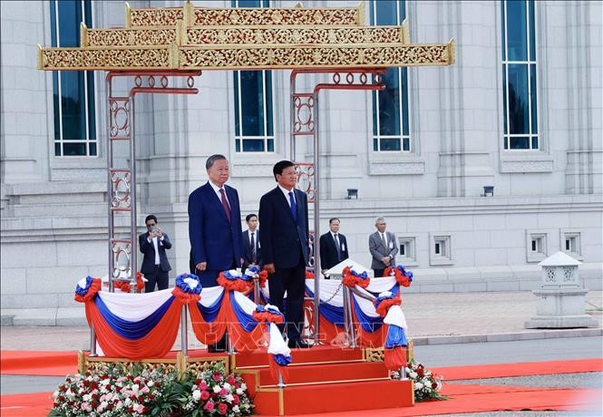 news.vnanet.vn-data-articles-2024-07-11-7476267-_vna_potal_le_don_chinh_thuc_chu_tich_nuoc_to_lam_tham_cap_nha_nuoc_toi_chdcnd_lao___stand.jpg