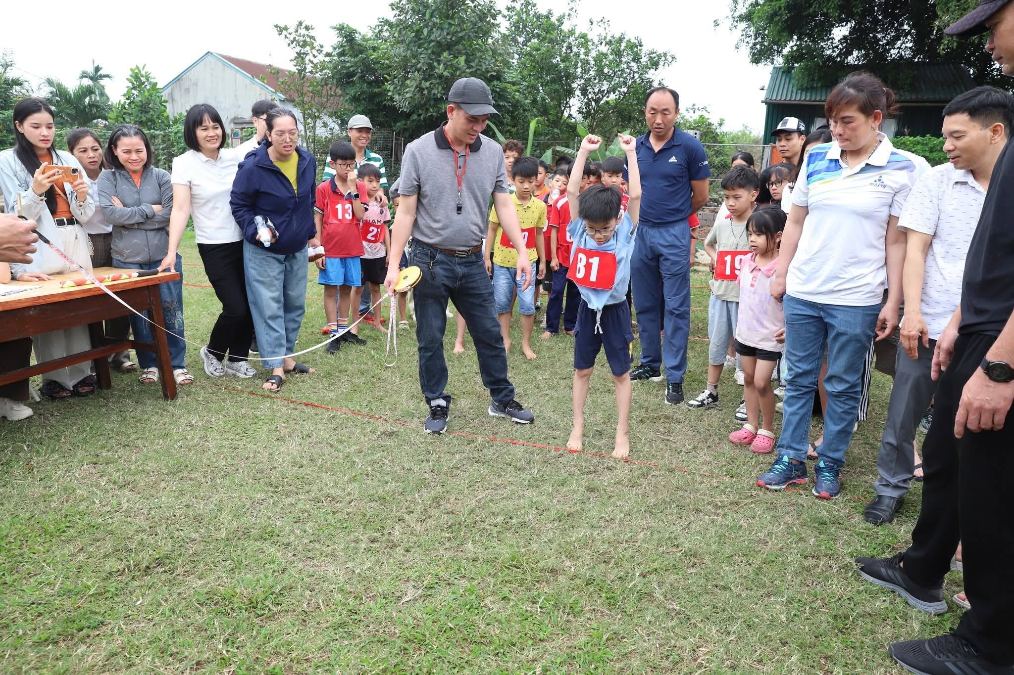 Students enthusiastically competing in the sports event.