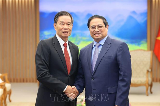 Thủ tướng Phạm Minh Chính tiếp Chủ tịch Ủy ban Trung ương Mặt trận Lào xây dựng đất nước
